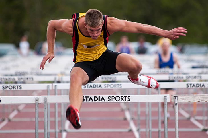 Maile Athlete doing the hurddles